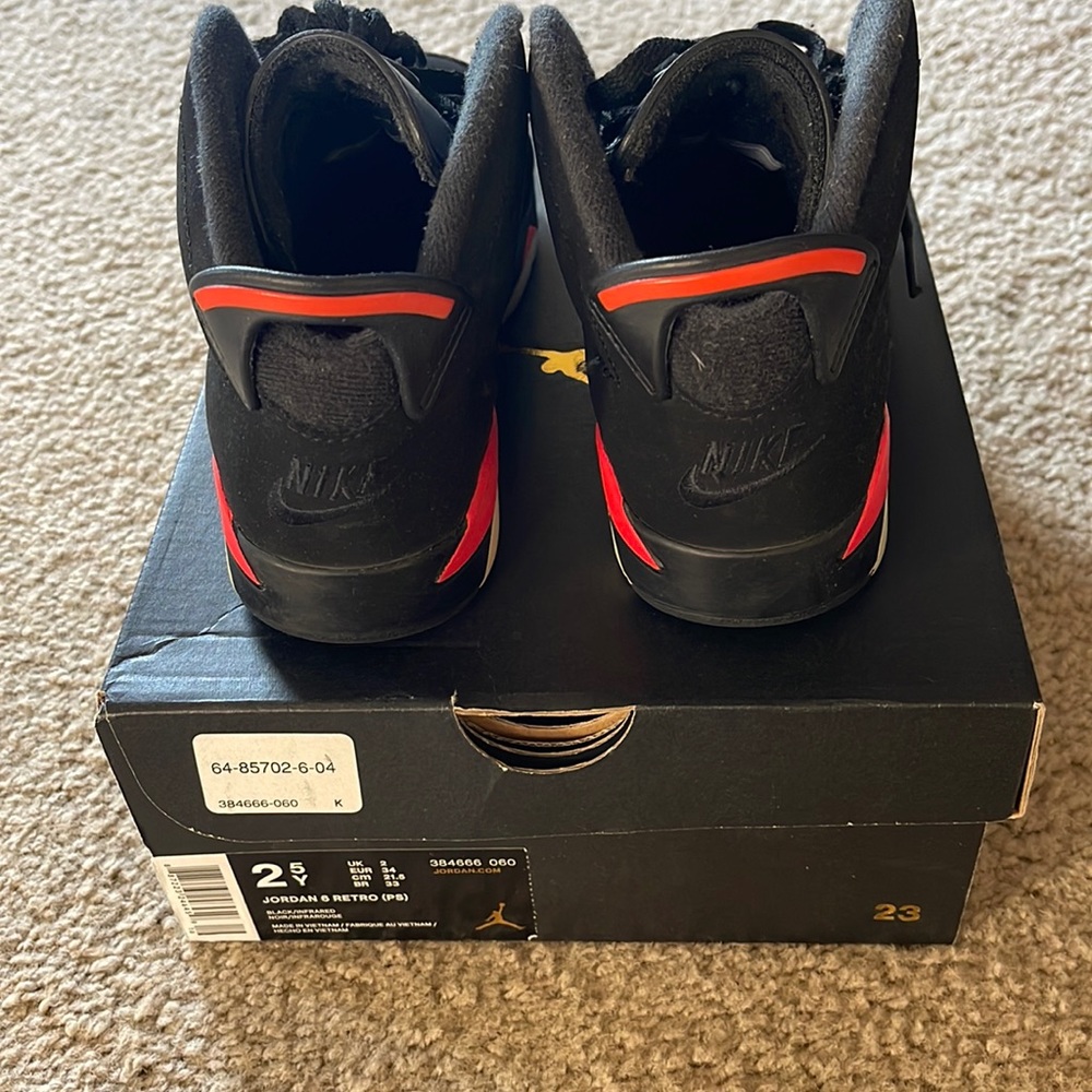 Jordan Black and Red Sneakers with Signature Silhouette